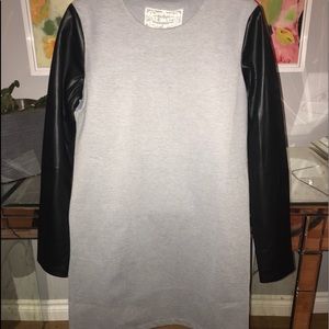 Beautiful leather arm and gray dress